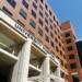 Alternate Text: Photo of a University of Alabama at Birmingham building, displaying the words “University Hospital.” Source: Flickr