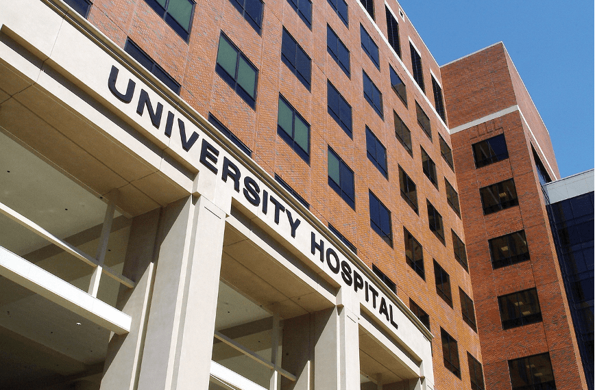 Alternate Text: Photo of a University of Alabama at Birmingham building, displaying the words “University Hospital.” Source: Flickr