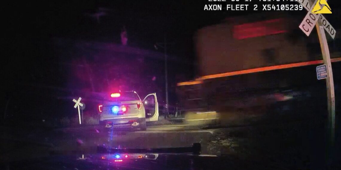 Former Colo. officer pleads guilty to parking cruiser on railroad tracks after detainee severely injured