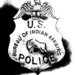 An image of an old U.S. Bureau of Indian Affairs police badge. Source: Yahoo Images via Flickr              