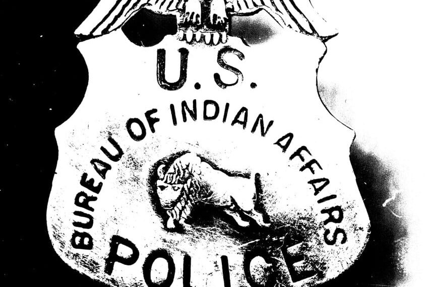 An image of an old U.S. Bureau of Indian Affairs police badge. Source: Yahoo Images via Flickr              