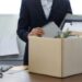 Resignation concept.Businesswoman packing personal company belongings when she deciding resignation change of job or fired from the company.