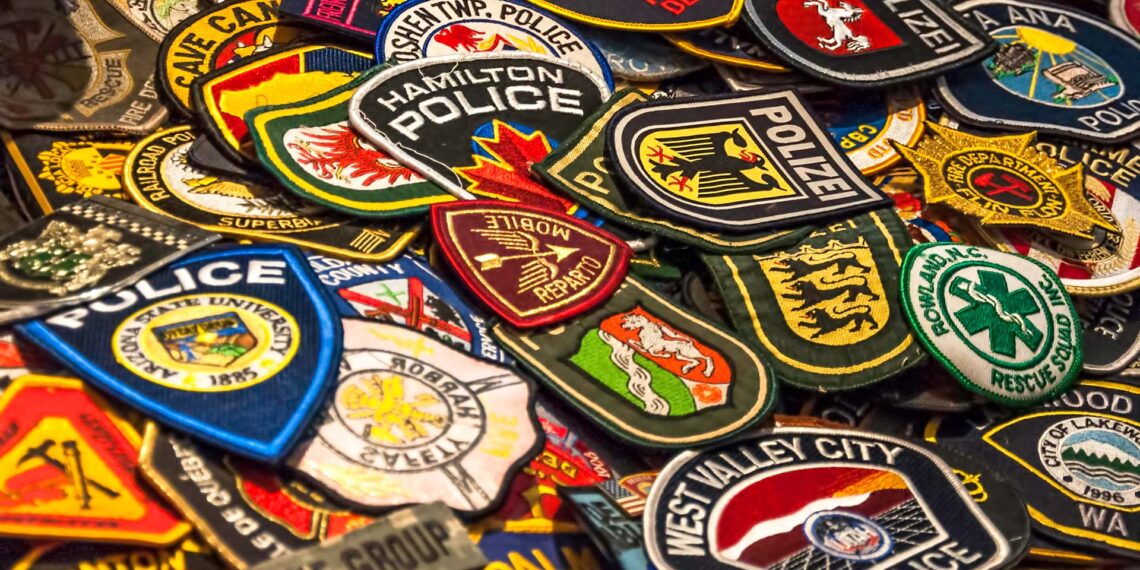 Young law enforcement enthusiast collects patches from agencies across the globe