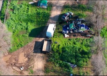 City crews, private land owner sweep encampment on North Sacramento property