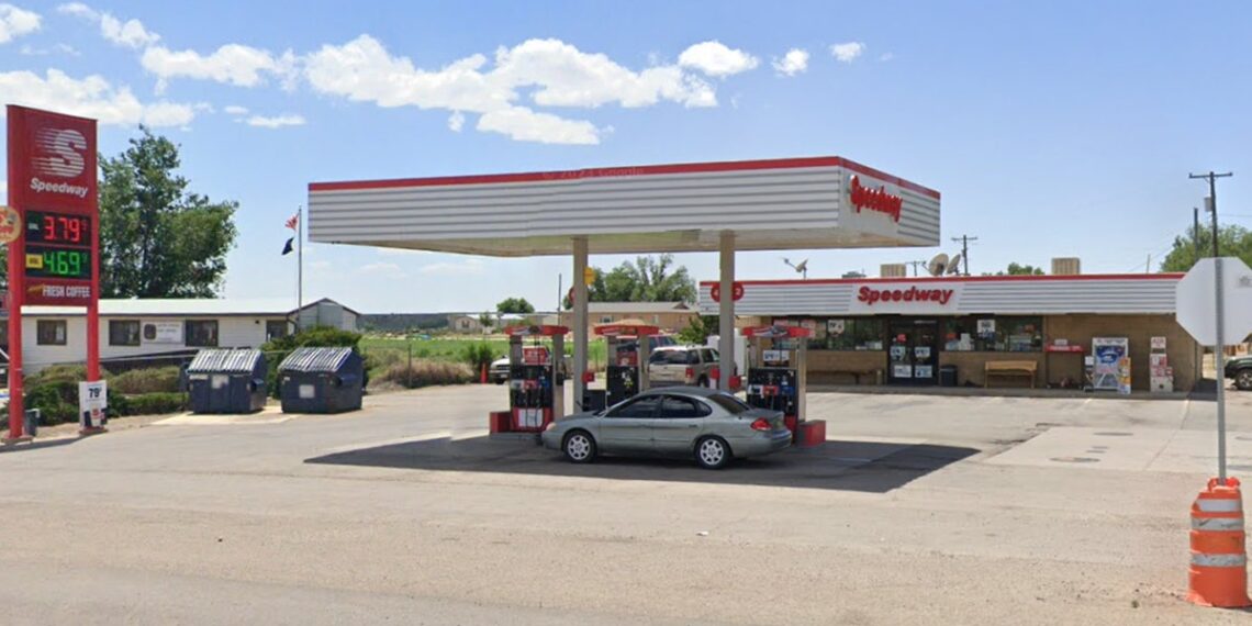 Speedway gas station, gas prices sign, car parked by gas pump, car parked by store