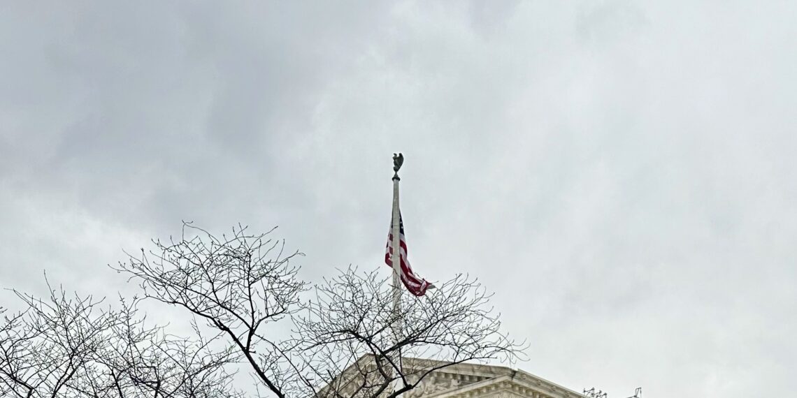 cloudy sky, flag, and supreme court