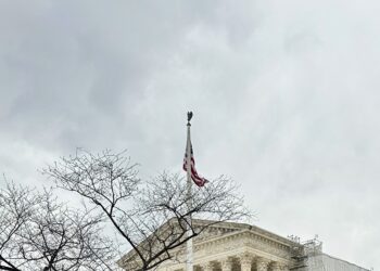 cloudy sky, flag, and supreme court