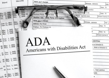 ADA paperwork with a pair of glasses on top of it