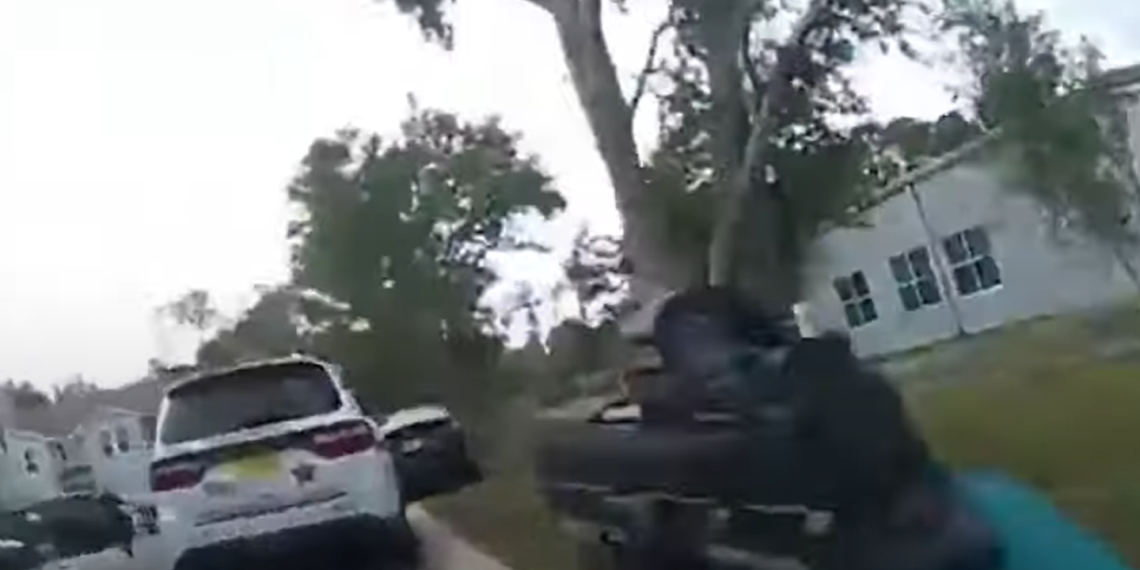 Fla. officer shoots at cuffed suspect after mistaking acorn landing on cruiser for gunfire