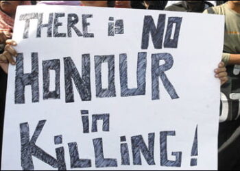 An image with a group of people holding up a banner that reads, "There is no honor in killing!"
