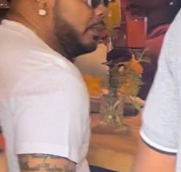 Male suspect sitting at a table