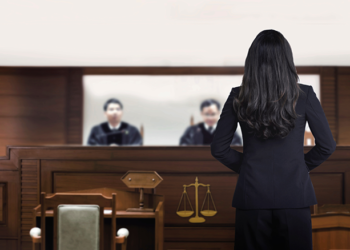 Woman attorney speaks to judges