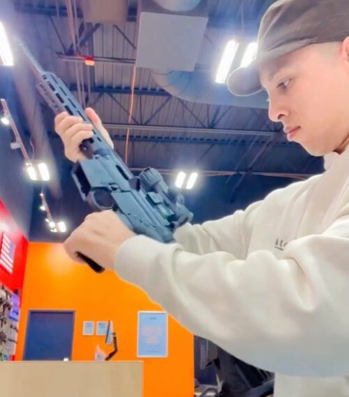 Leonel Moreno holding a firearm